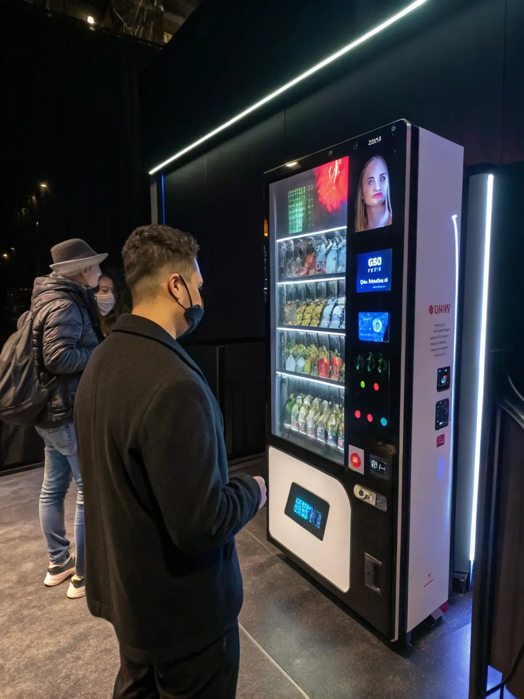 A vending machine with a customizable interface, showcasing different branding options and product layouts. The machine's screen displays a variety of product images and promotional messages, tailored to the specific location and target audience.